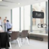 Office meeting behind glass doors